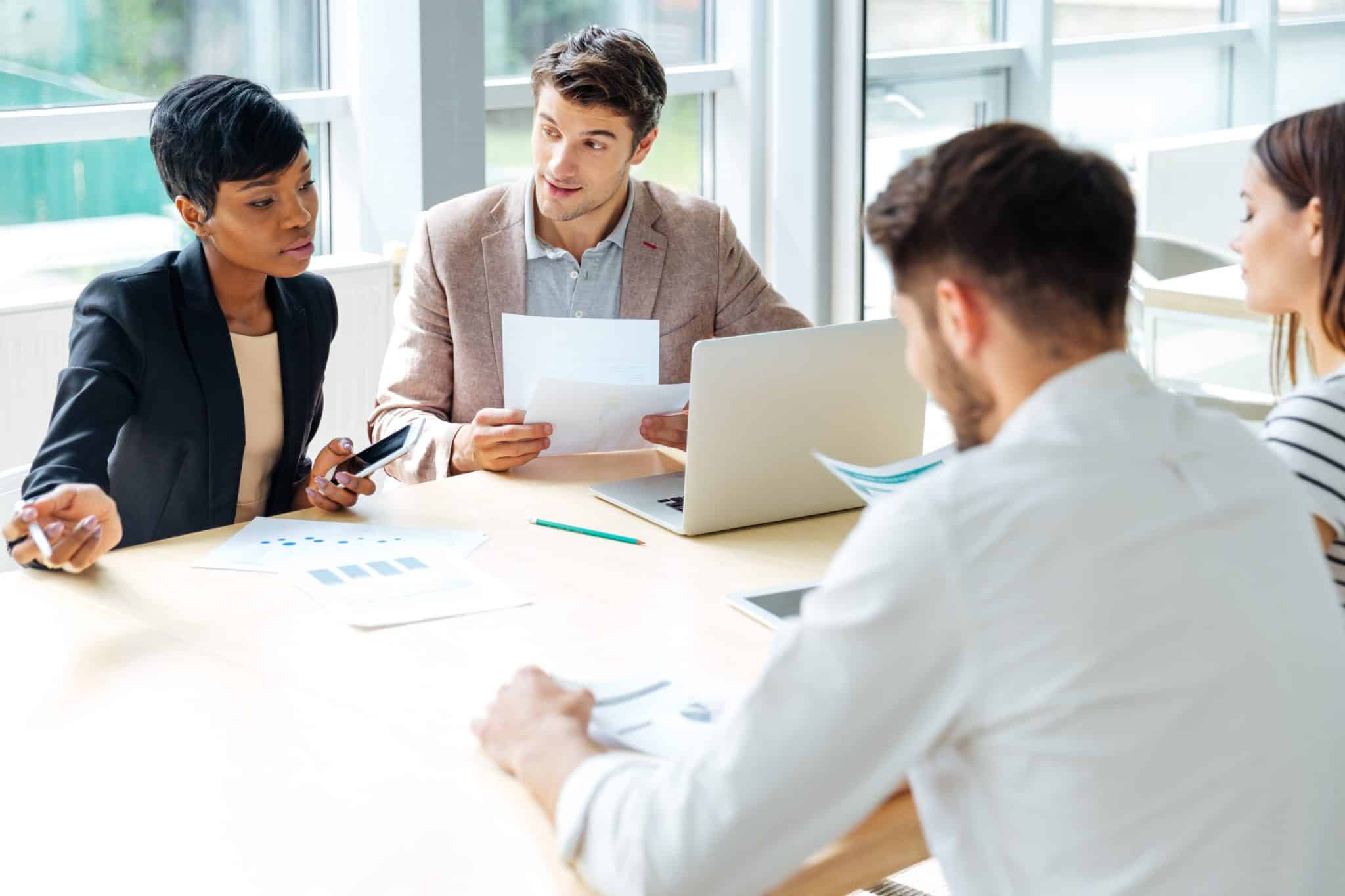 Businesspeople working together on business meeting in conference room Business people in a meeting